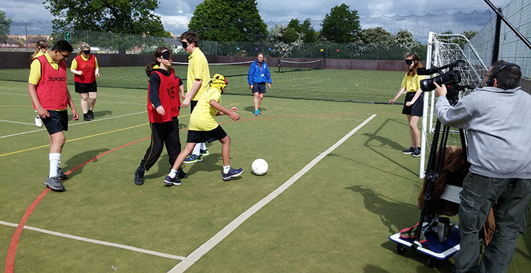 Students at Bushey Meads School are filmed playing audible football