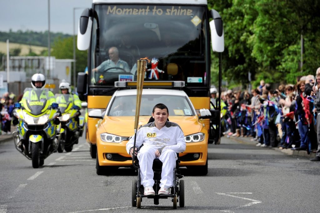 Jamie McCowan carries the 2012 Olympic torch